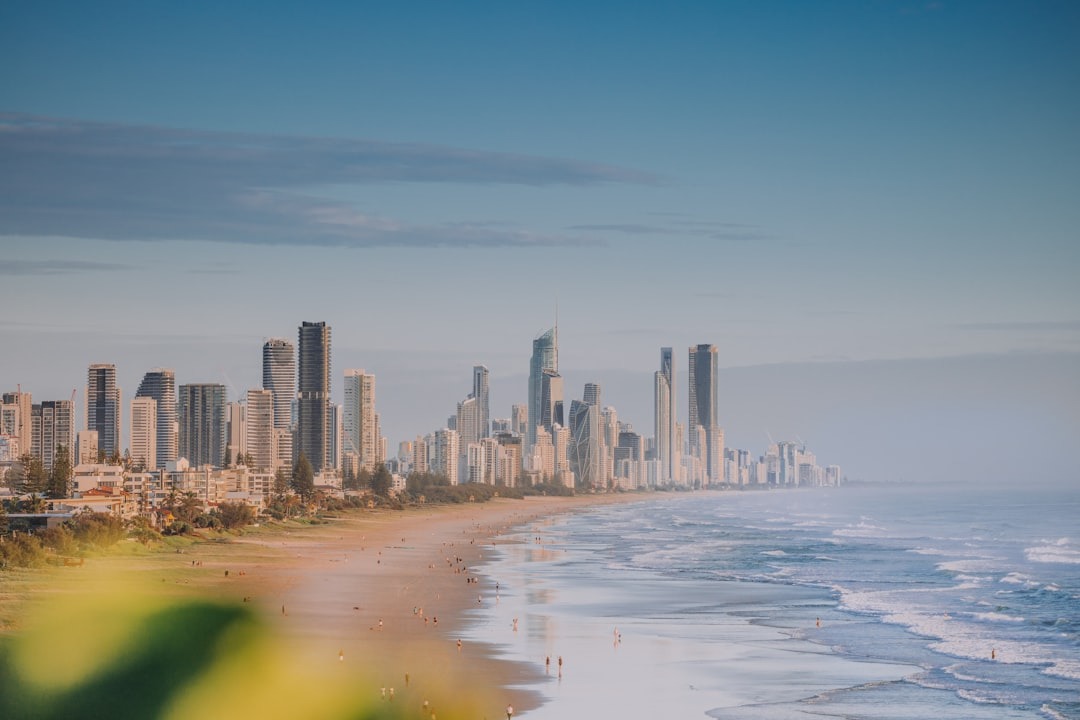 a view of a beach with a city in the background